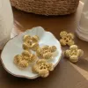 A fashionable and elegant set of golden flower-shaped earrings and necklaces for ladies details Picture